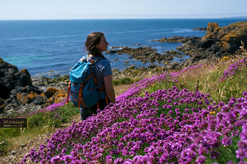 Hiking among island flowers in a protected nature reserve