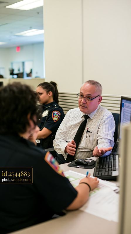 Police chief speaking with officers about workplace issues