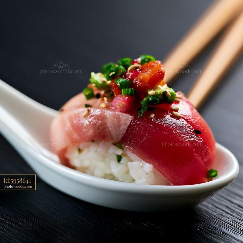 Single sushi piece with colorful fish topping served on a spoon