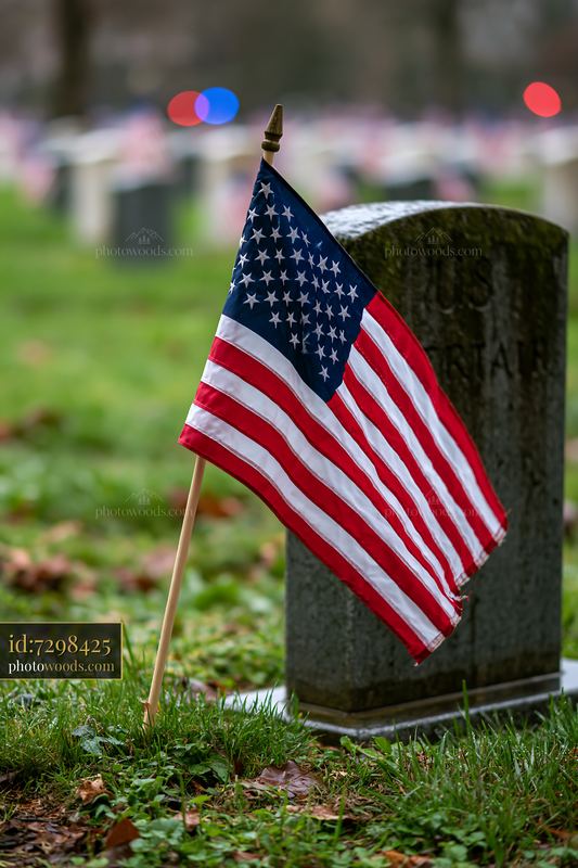 American flag at Arlington cemetery surrounded by headstones