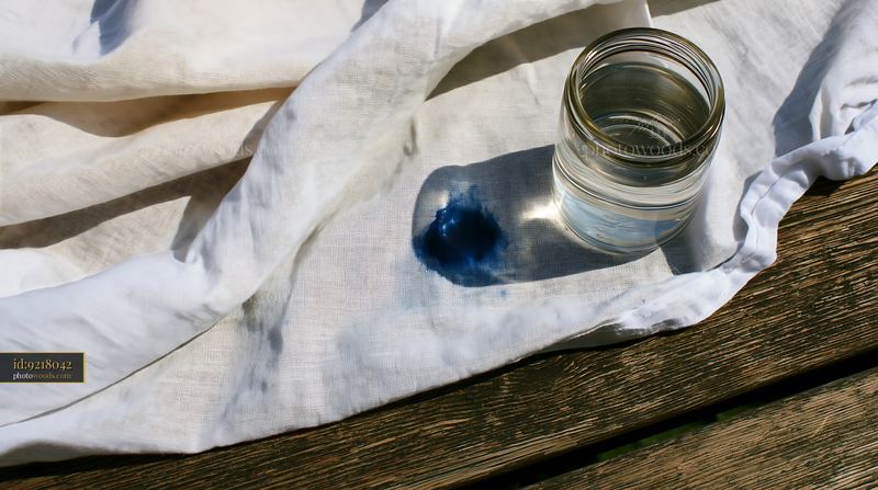 Watercolor stain on muslin fabric with a glass jar of water
