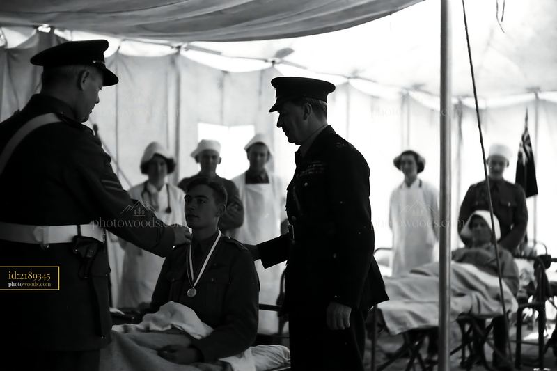 Soldier receives medal in military hospital setting