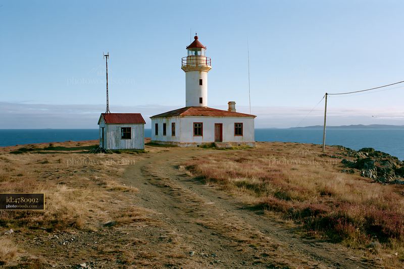 Abandoned lighthouse on a remote coast with seaside view