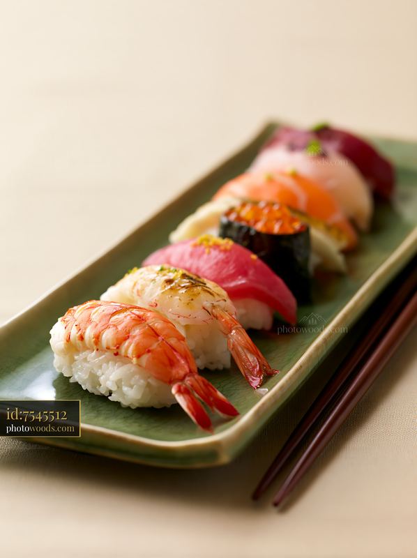 Sushi platter with negative space on a simple background