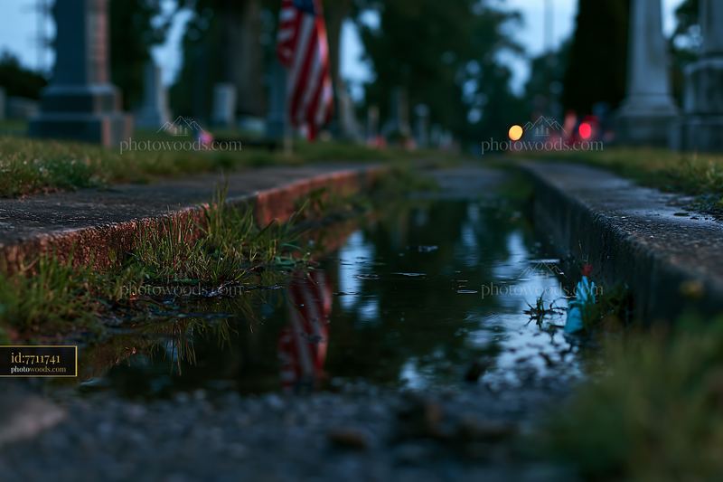 Veterans cemetery with American flag at dusk