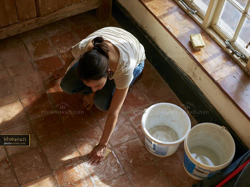Renovation work in a country house with a woman cleaning