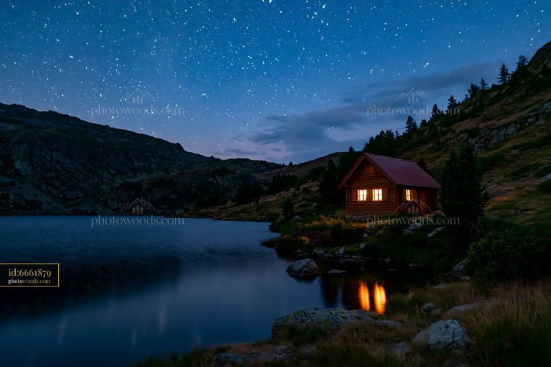 Isolated cabin under a starry sky near a calm lake