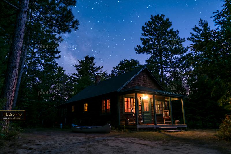 Holiday home under stars with a canoe near forest