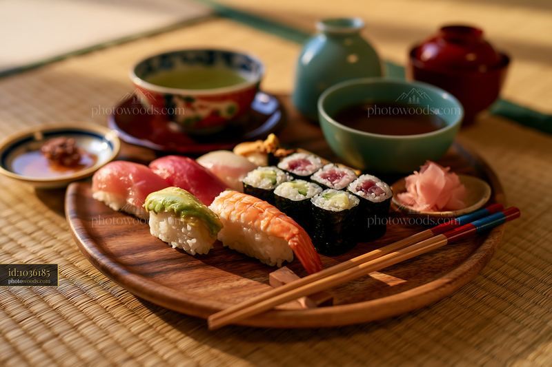 Sushi served with tea on a wooden tray in a traditional setting