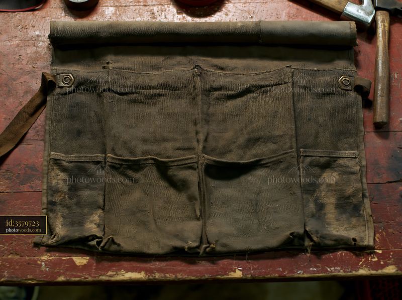 Old fabric texture with faded blotches on a workbench