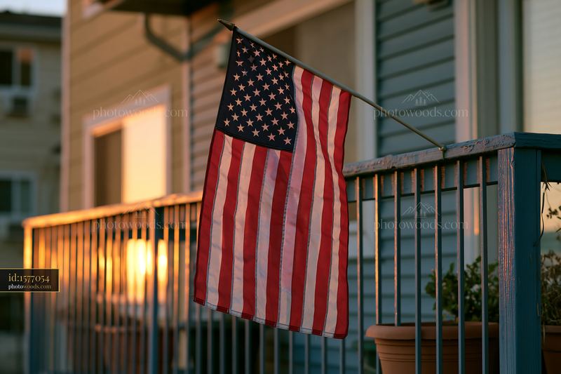 American flag outside apartment building at sunset