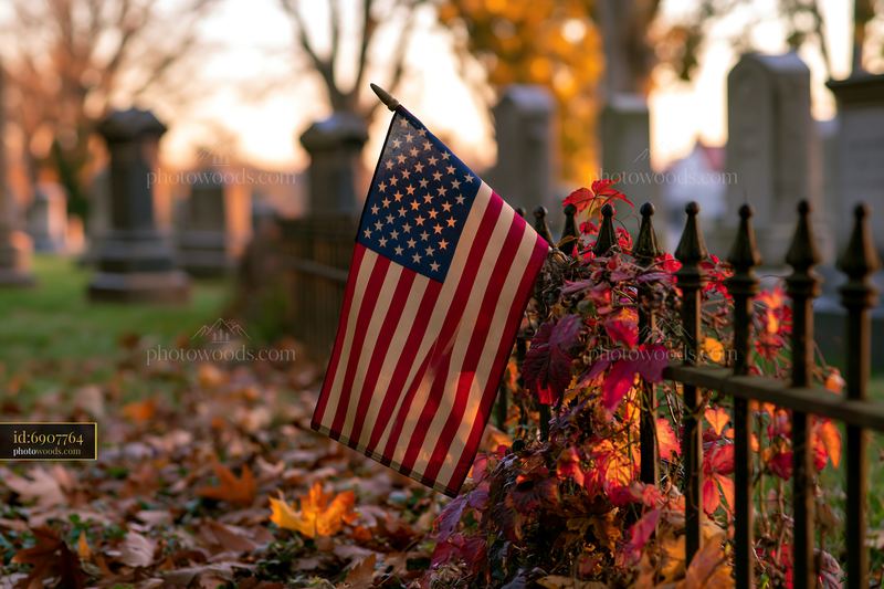 American flag at Arlington cemetery with autumn leaves