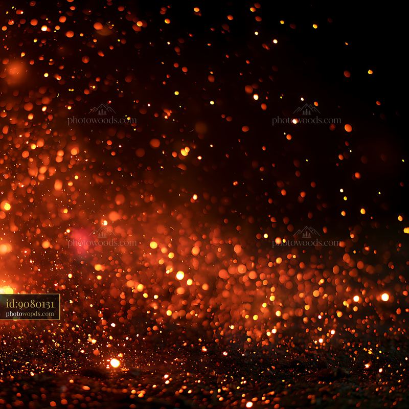 Glowing sparks flying against a dark background