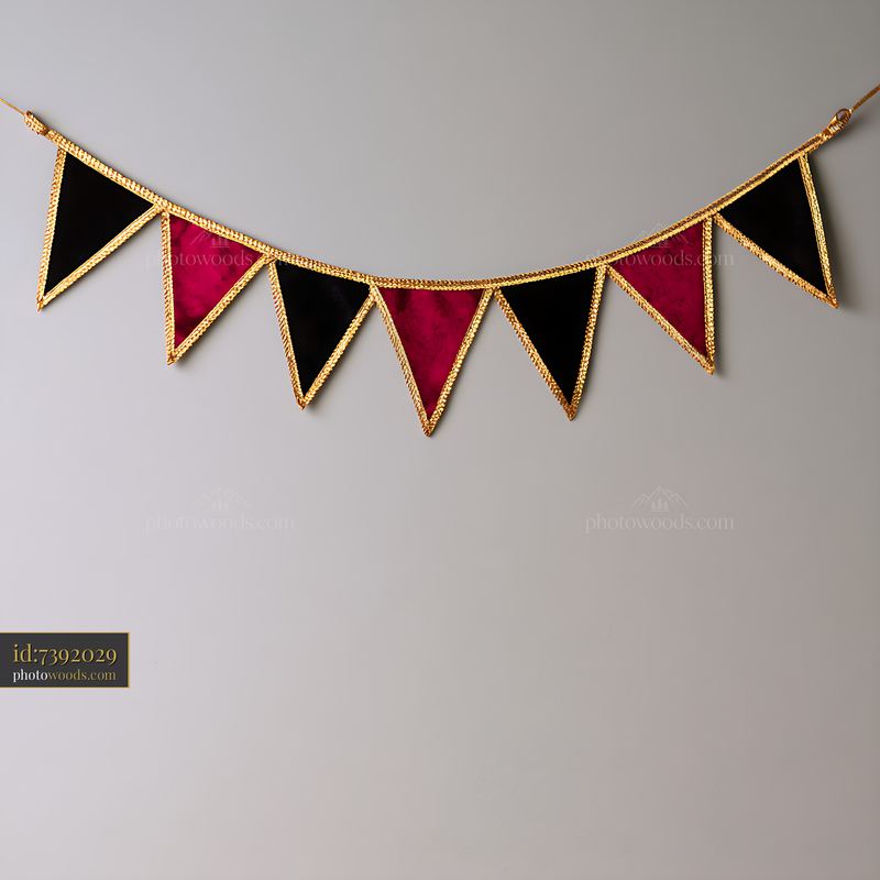 Bunting Flags in Black, Red, and Gold Colors Hanging on a Wall