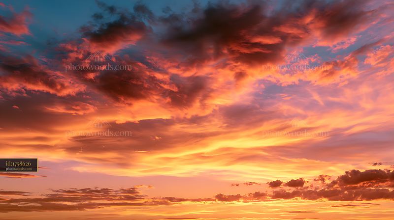 Clouds Shaped by Wind During Sunset Over Coastal Landscape