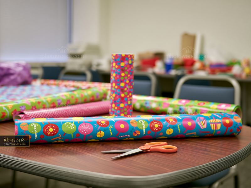 Birthday wrapping paper and scissors on a table
