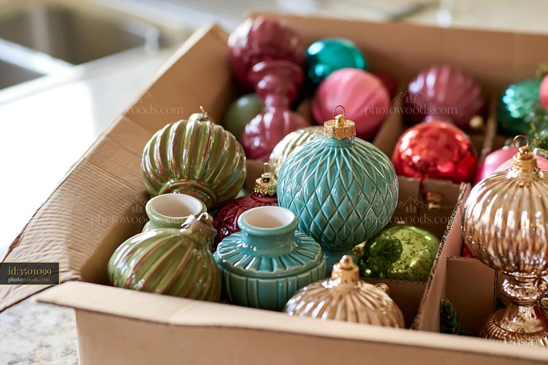 Colorful Christmas ornaments packed in a cardboard storage box