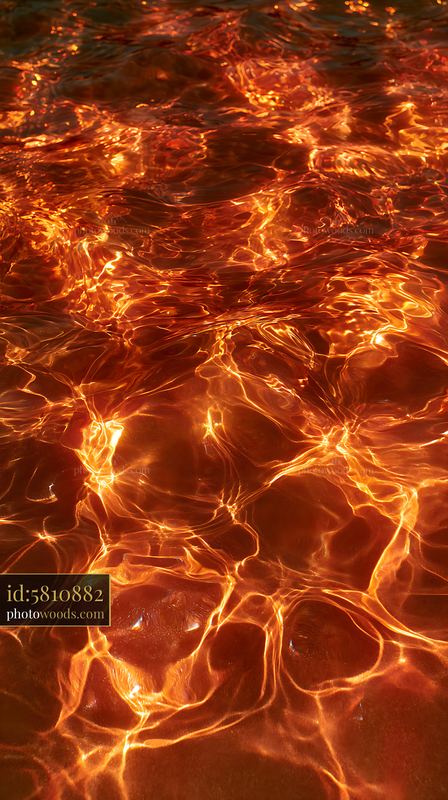 Deep Water Surface With Light Reflections in Warm Tones