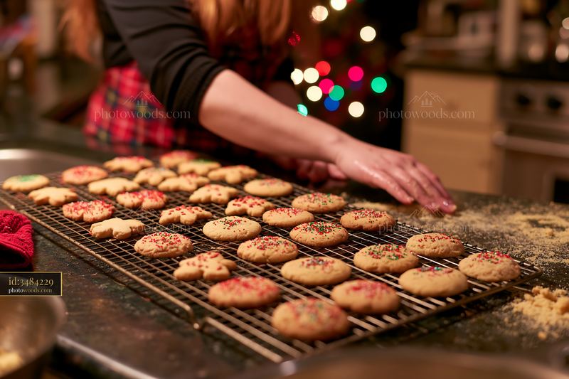 Christmas cookies cooling on kitchen rack with colorful decorations