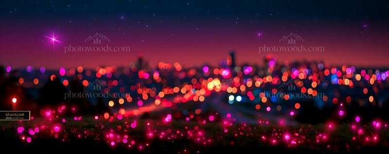 City skyline at night with blurred lights and colorful bokeh