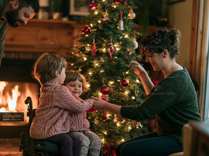 Family decorating a Christmas tree with ornaments by the fireplace