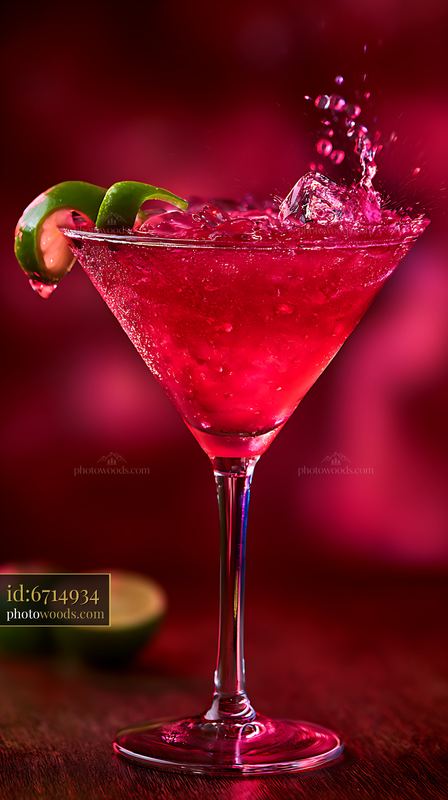 Ruby Cosmopolitan Cocktail in a Martini Glass With Lime Garnish