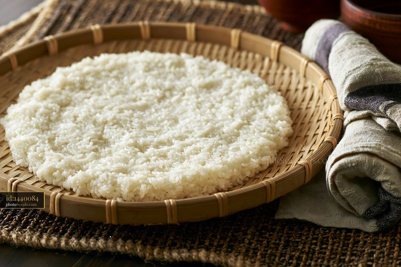 Sushi rice cooling on tray after preparation