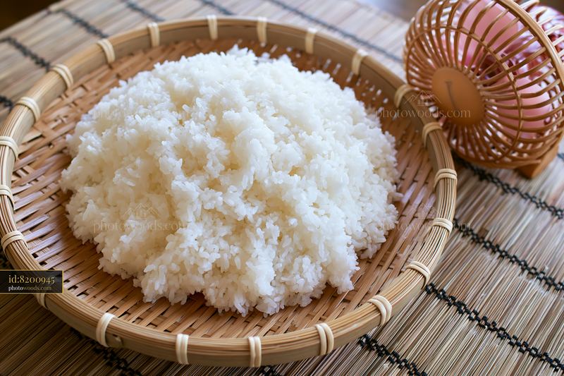 Sushi rice cooling on tray in a traditional setting