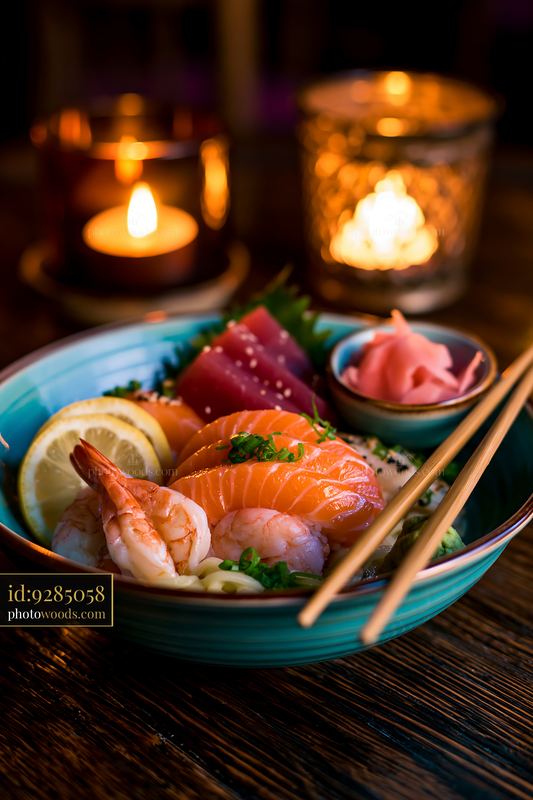 Sushi with chopsticks resting on bowl in a warm setting