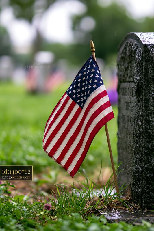 American flag waving near a grave at Arlington Cemetery