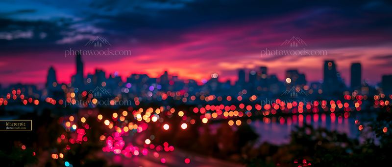 City skyline at dusk with blurred lights and colorful sky