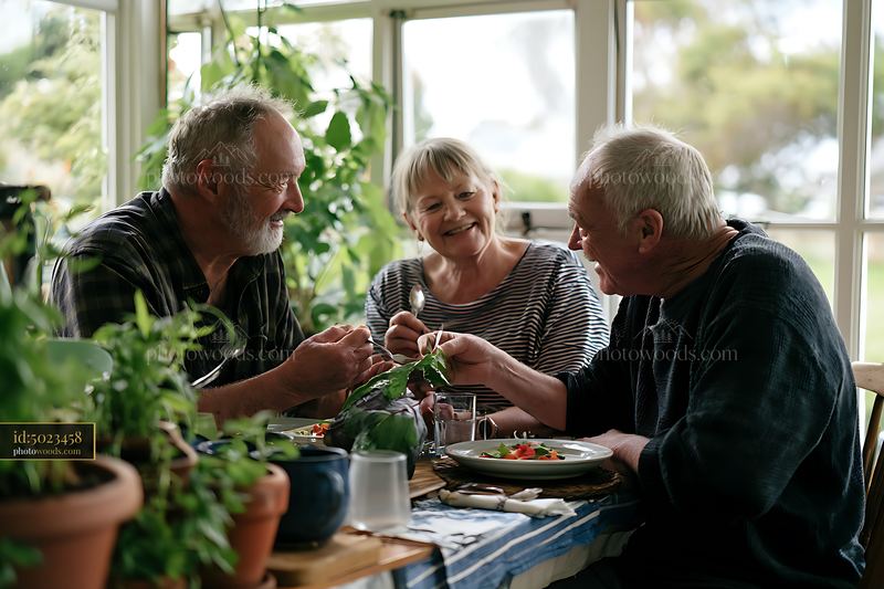Three seniors sharing a meal at home