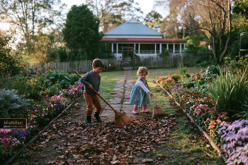 Children playing in farmhouse garden