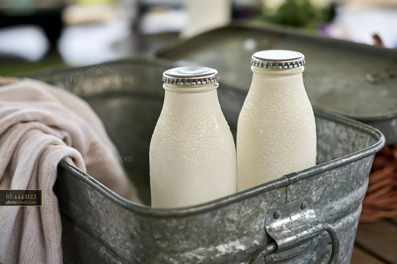 Cold milk bottles in a metal market cooler