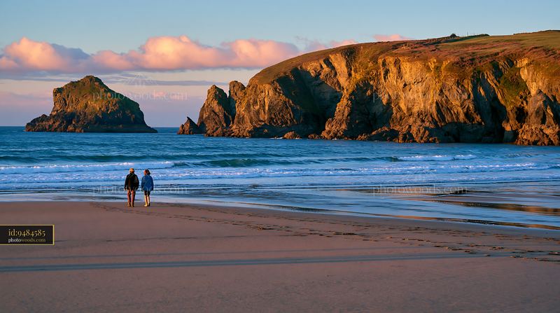Moody coastline with rocky peninsula during sunset