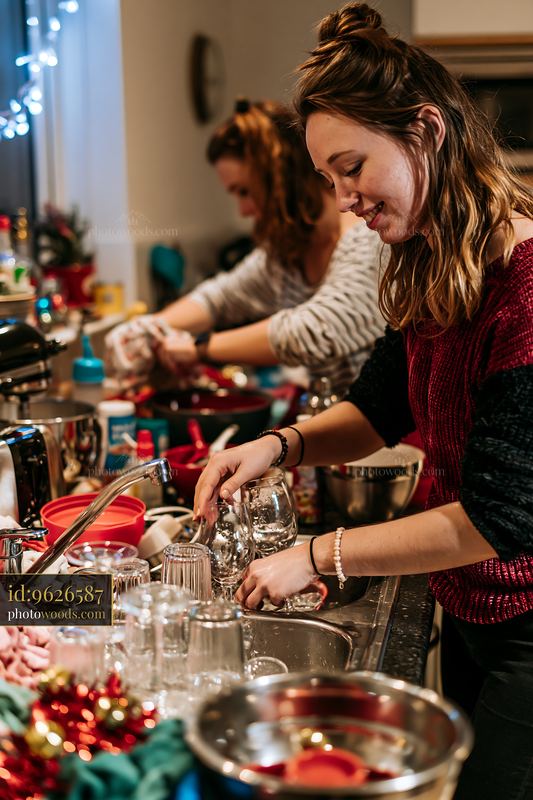 Women washing dishes after a Christmas celebration