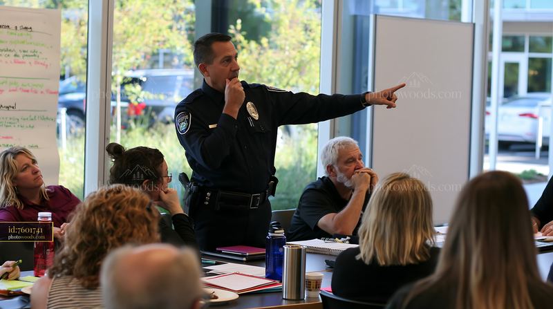 Police officer addressing a community meeting