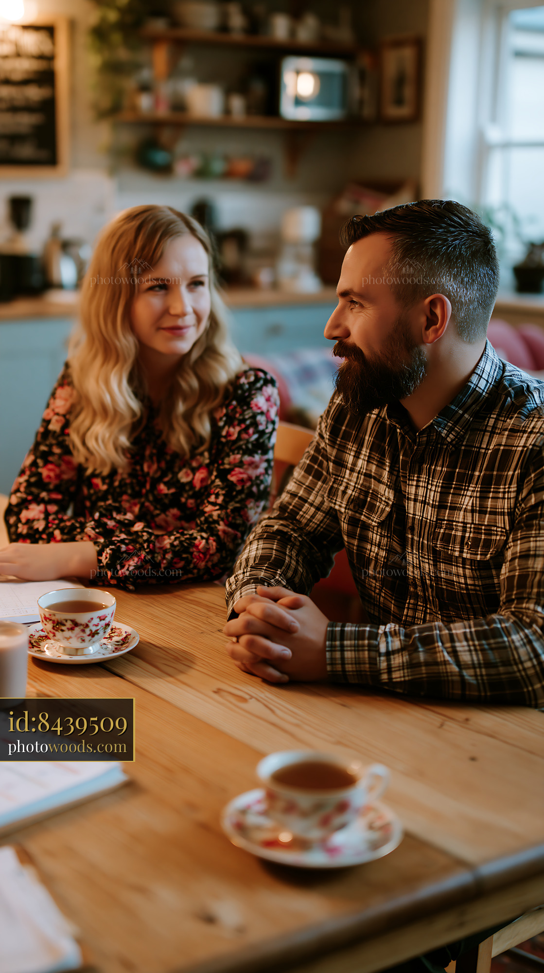 Co-parents Coordinating a Shared Calendar in a Cozy Cafe