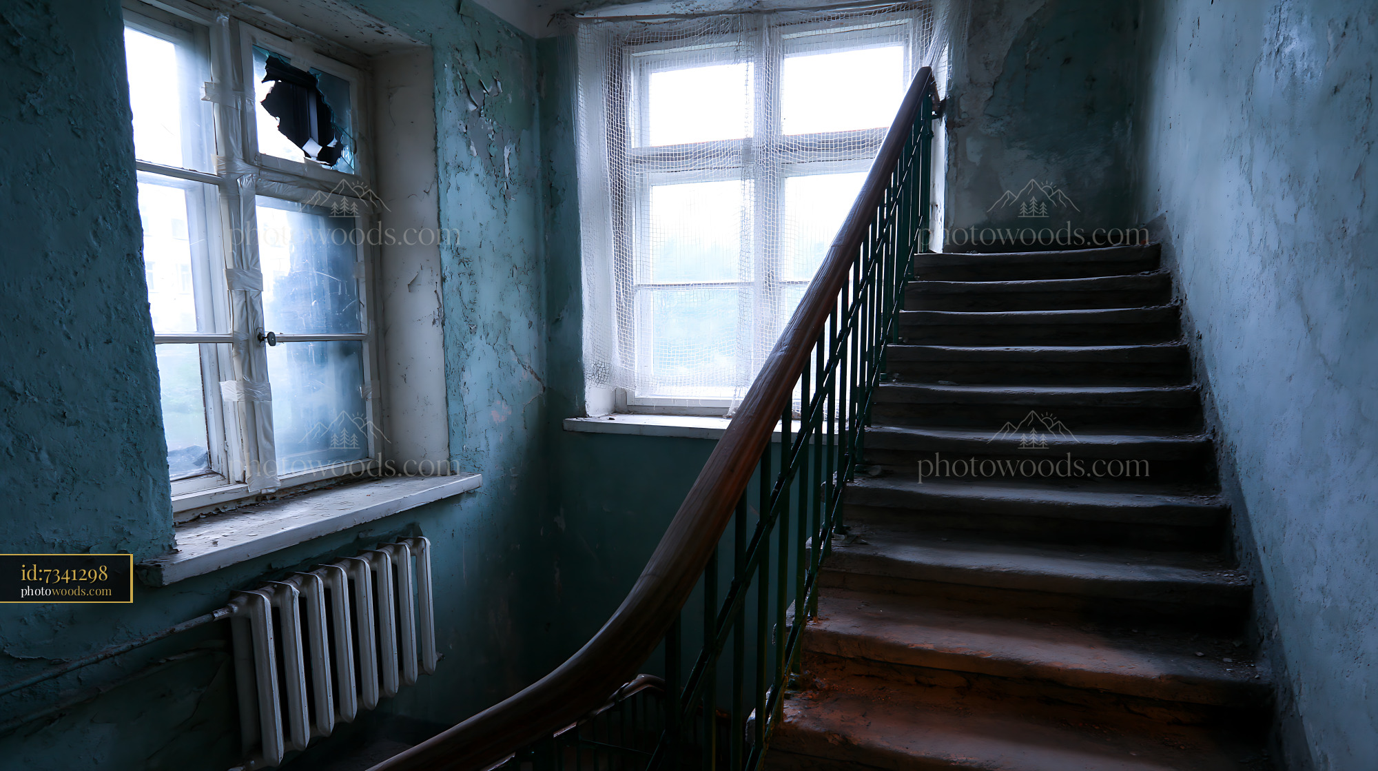 Decaying Stairwell in Apartment Block With Broken Windows