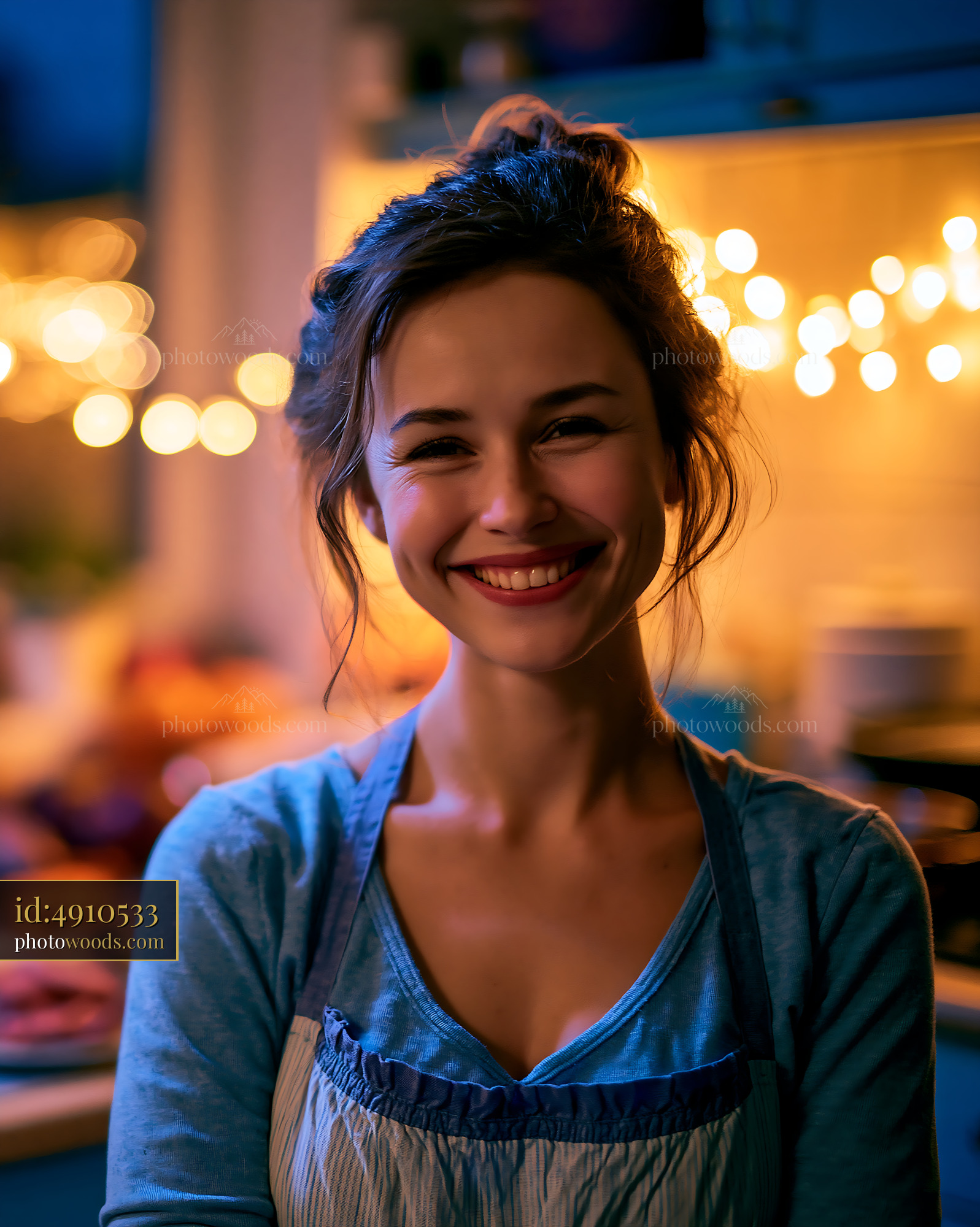 Woman Smiles Happily in Kitchen With Warm Lights and Cozy Decor