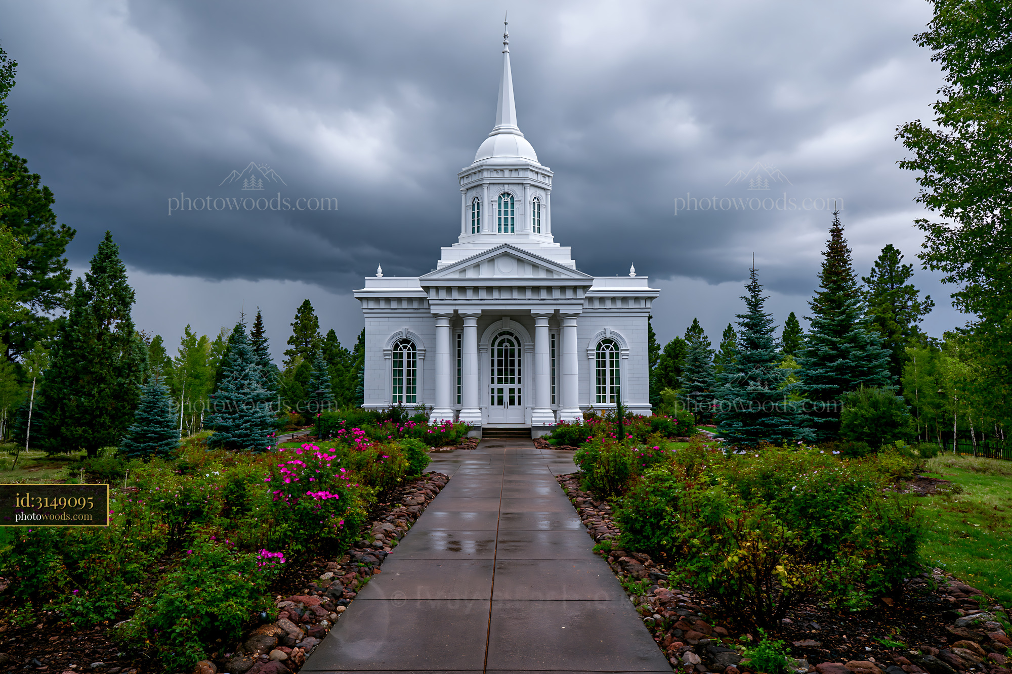 White Church Amid Trees and Flowers on a Cloudy Day