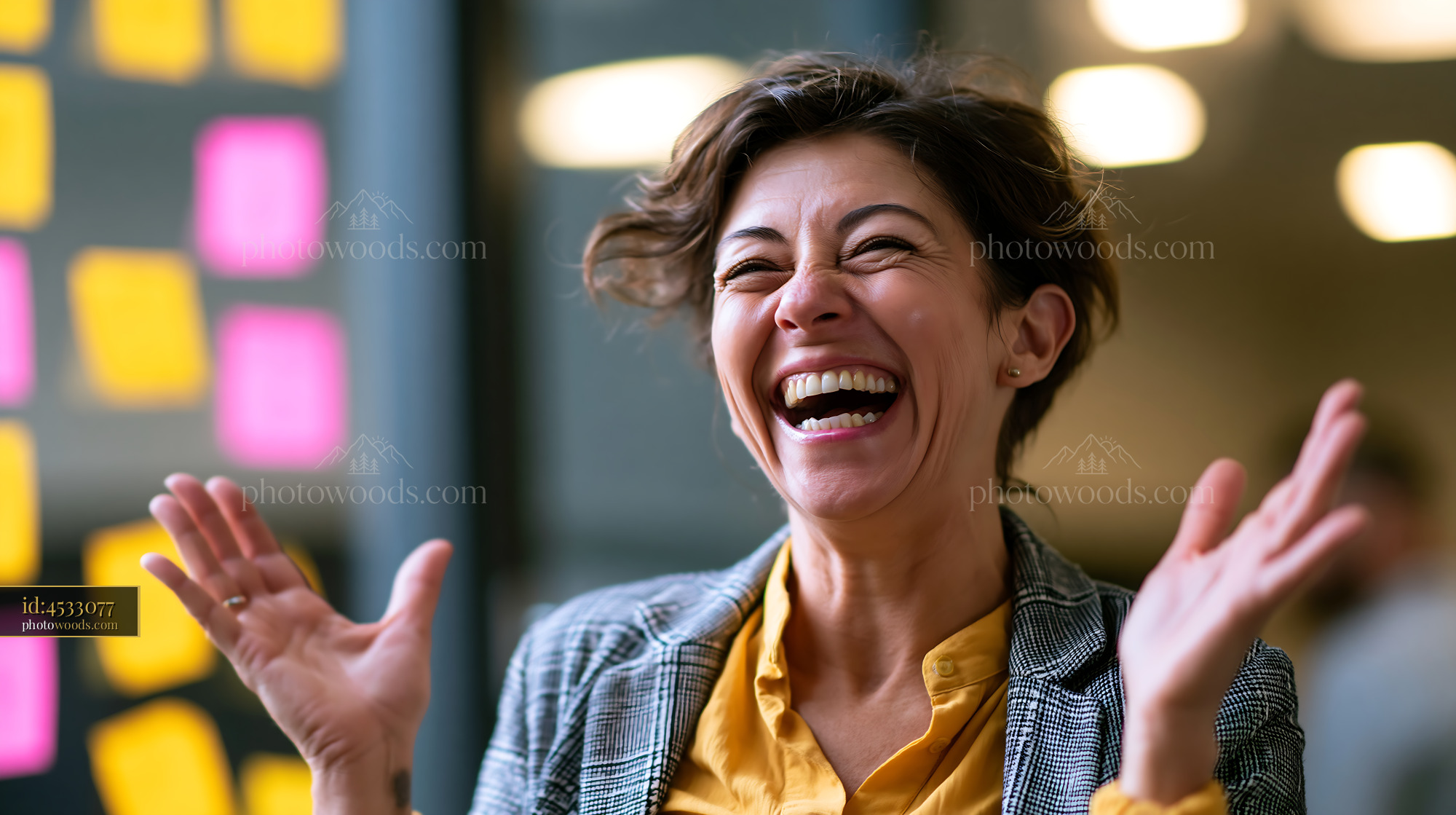 Joyful Teacher Using Sign Language With Laughter in a Classroom