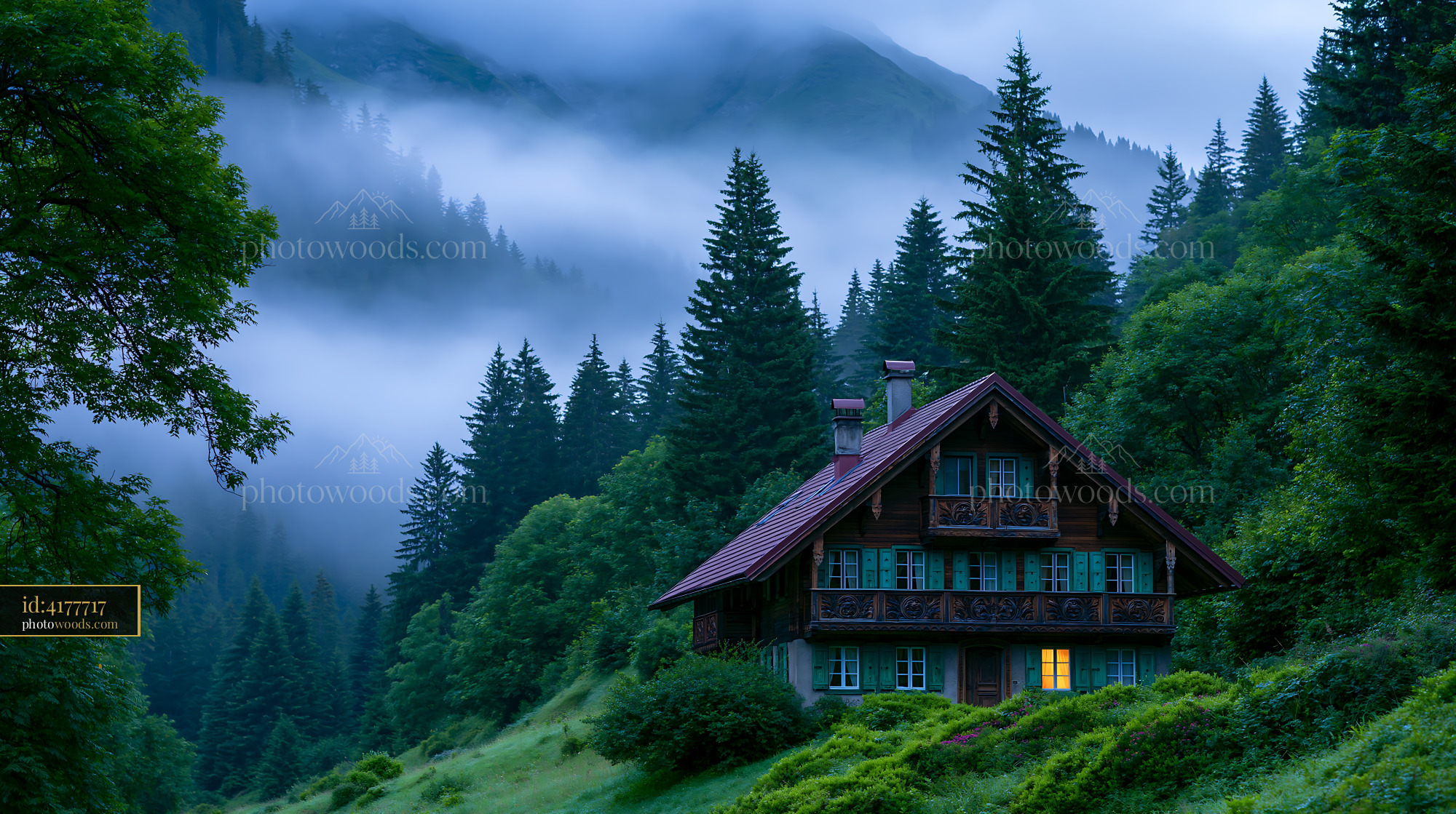 Wooden Chalet in Foggy Alpine Forest Surrounded by Mountains