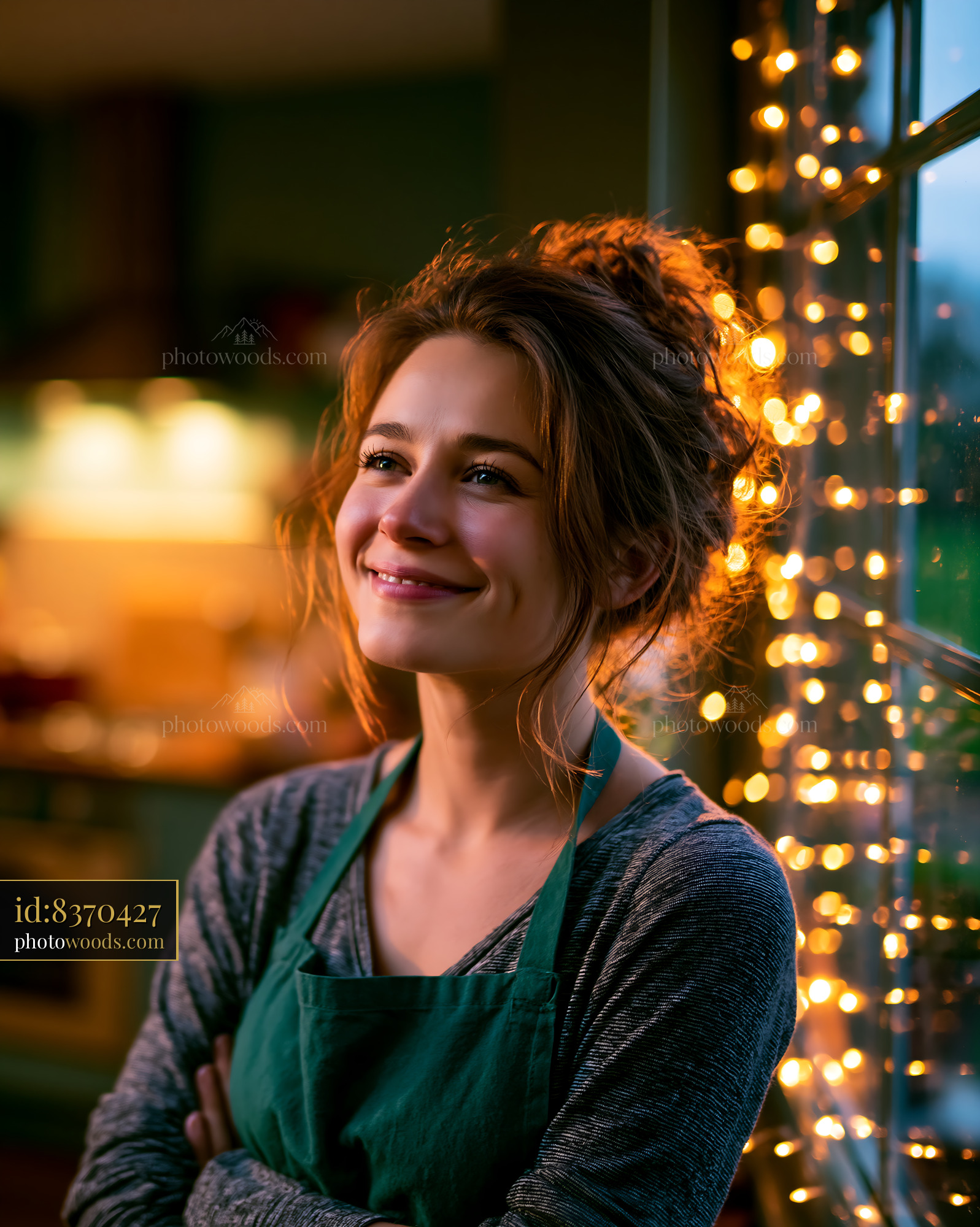 Woman Smiles While Leaning Against Window With Fairy Lights