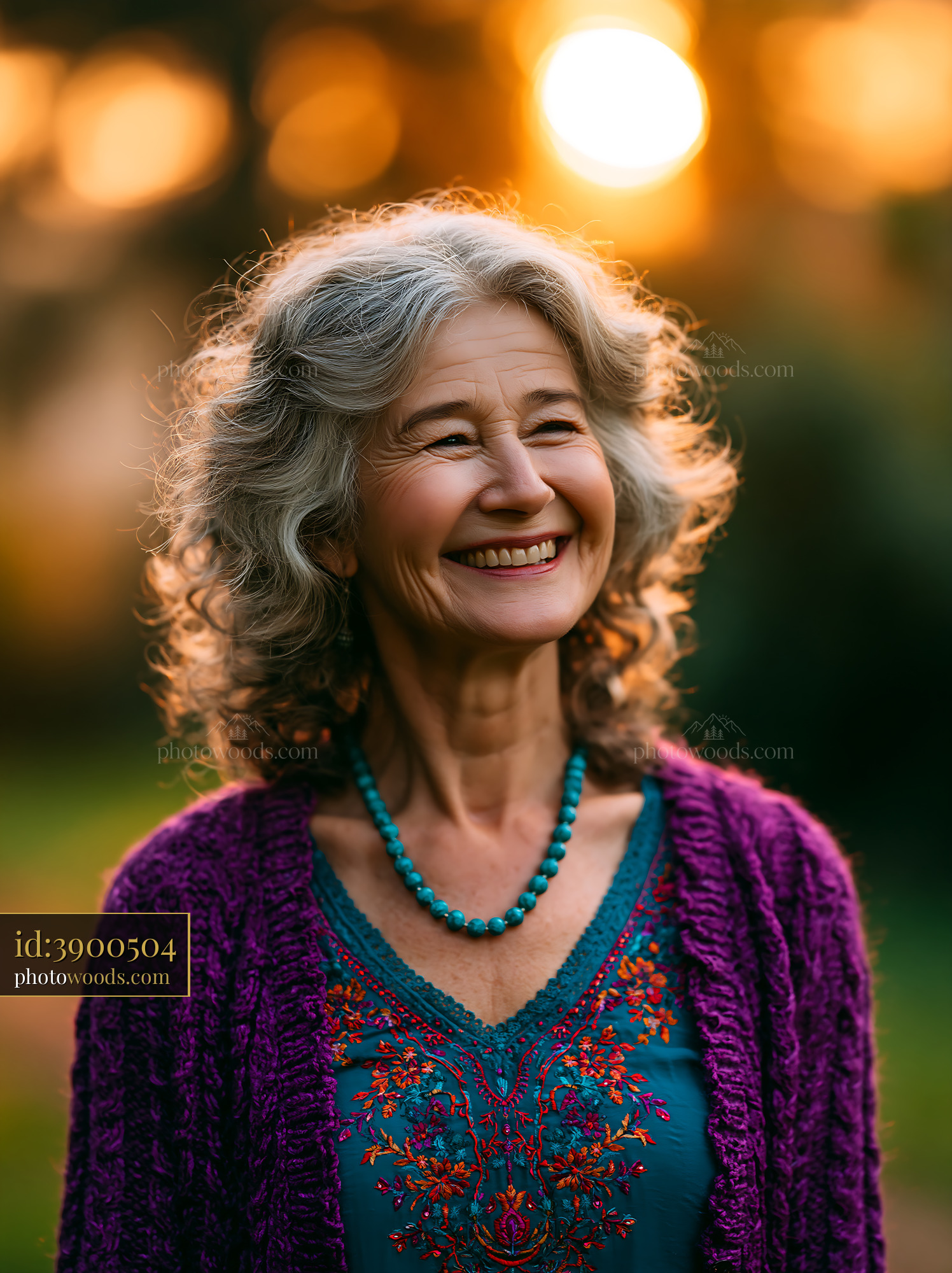 Older Woman Laughing Brightly in Garden During Golden Hour
