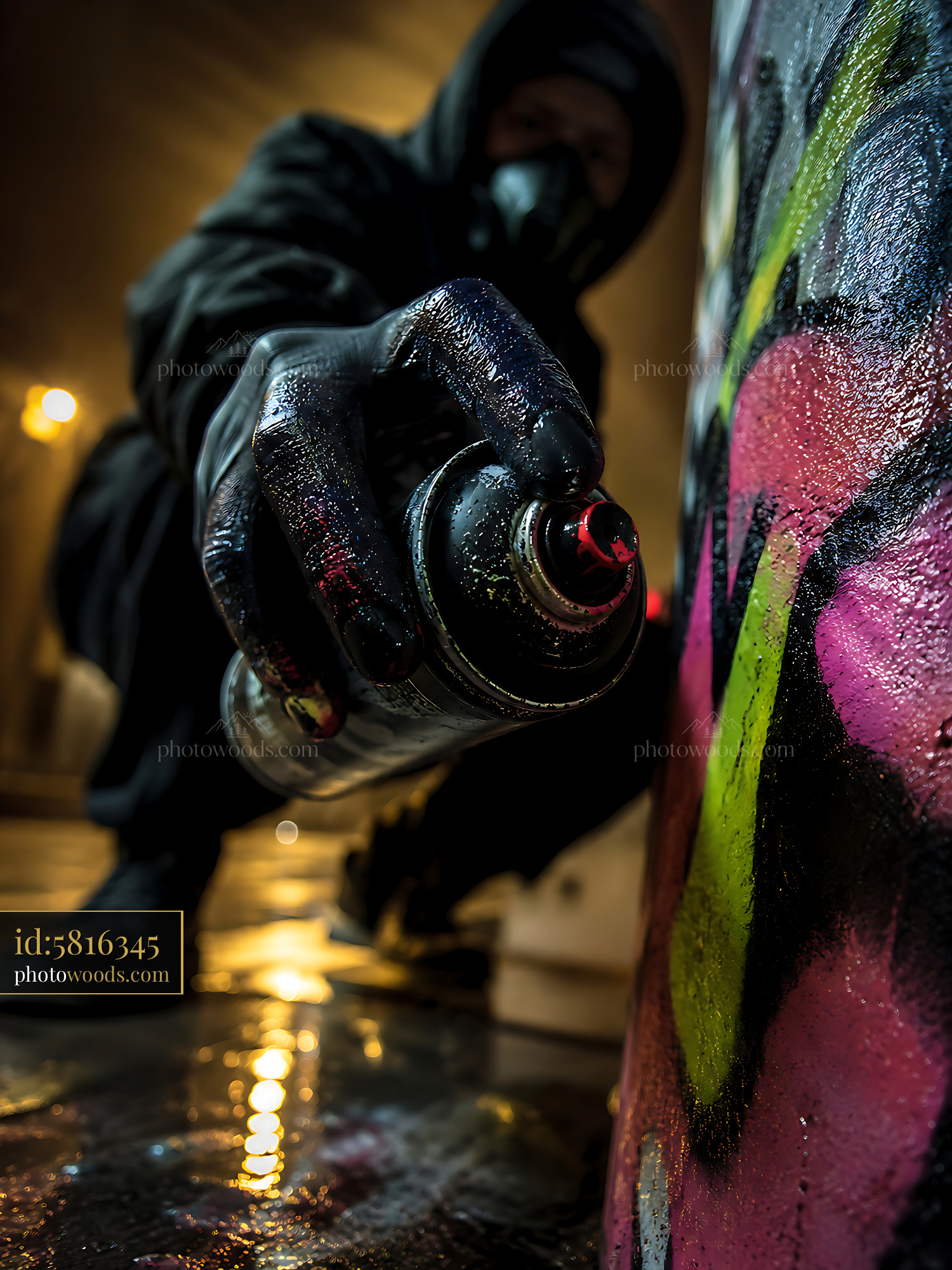 Graffiti Artist Uses Spray Can to Create Street Art at Night