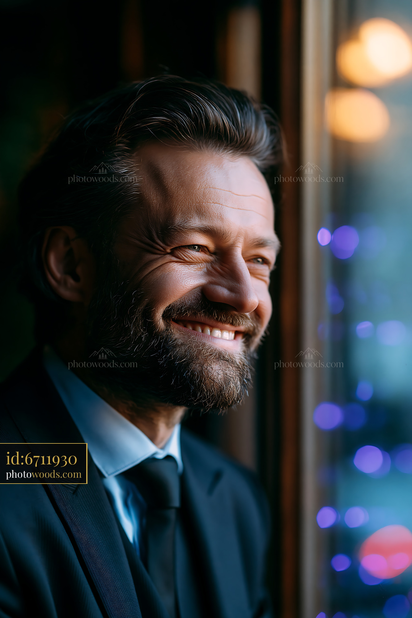 Man Smiling While Looking out the Window During Evening Hours