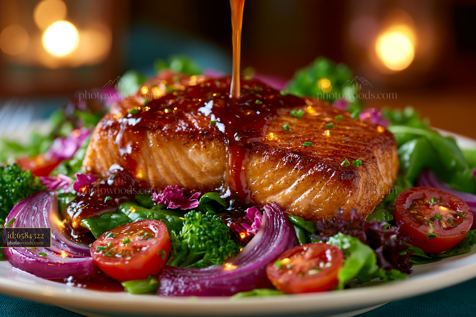 Seared Salmon Fillet With Sauce on Mixed Greens and Vegetables
