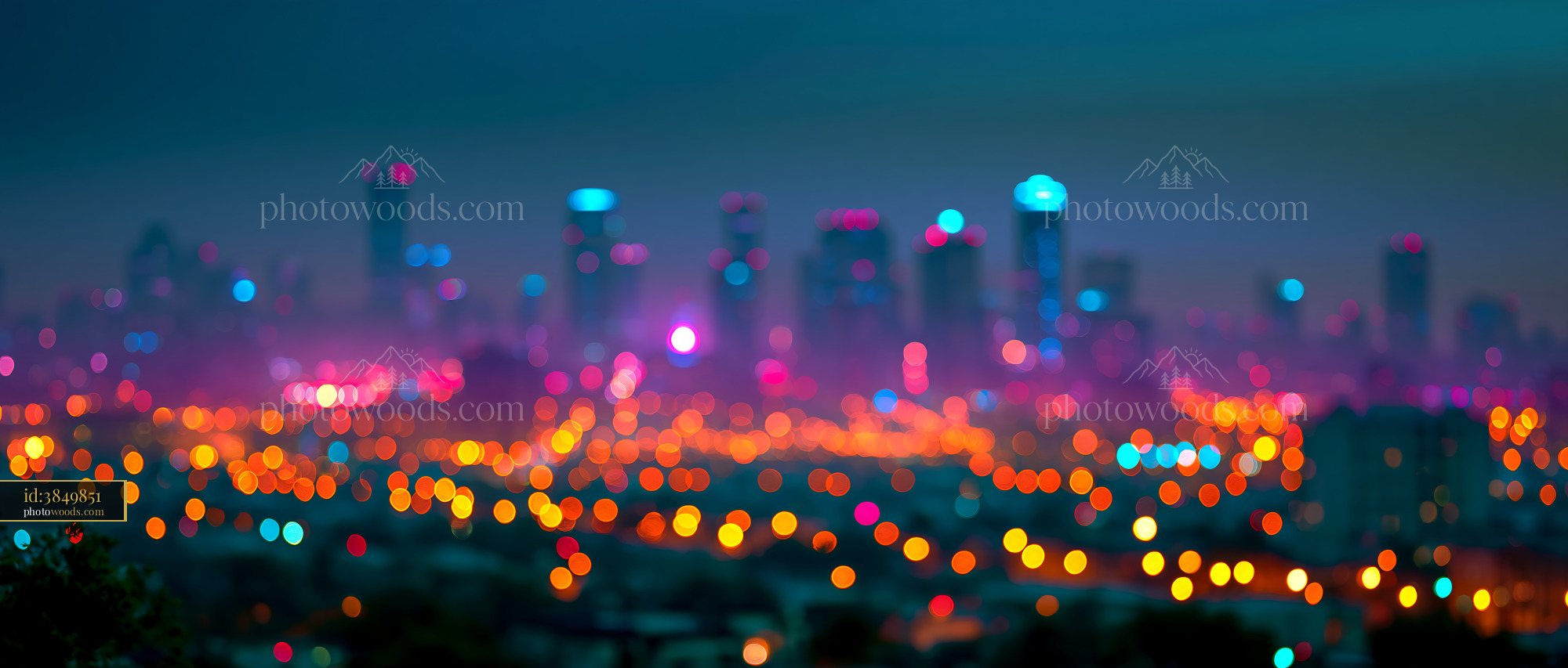 City Skyline Lights Illuminate Night Sky With Blurred Background