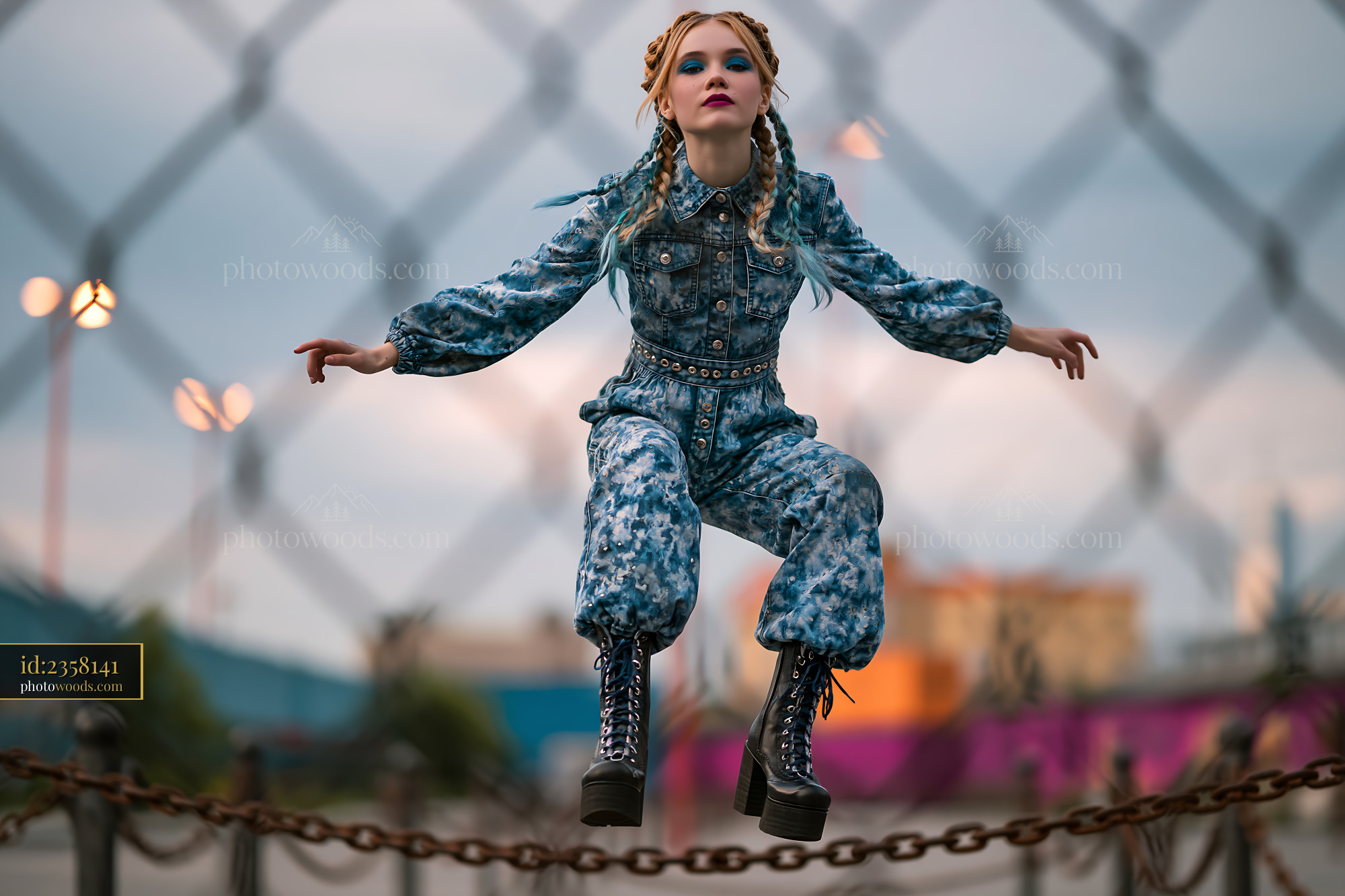Model With Braided Hair in Acid Wash Outfit Jumping in Urban Setting